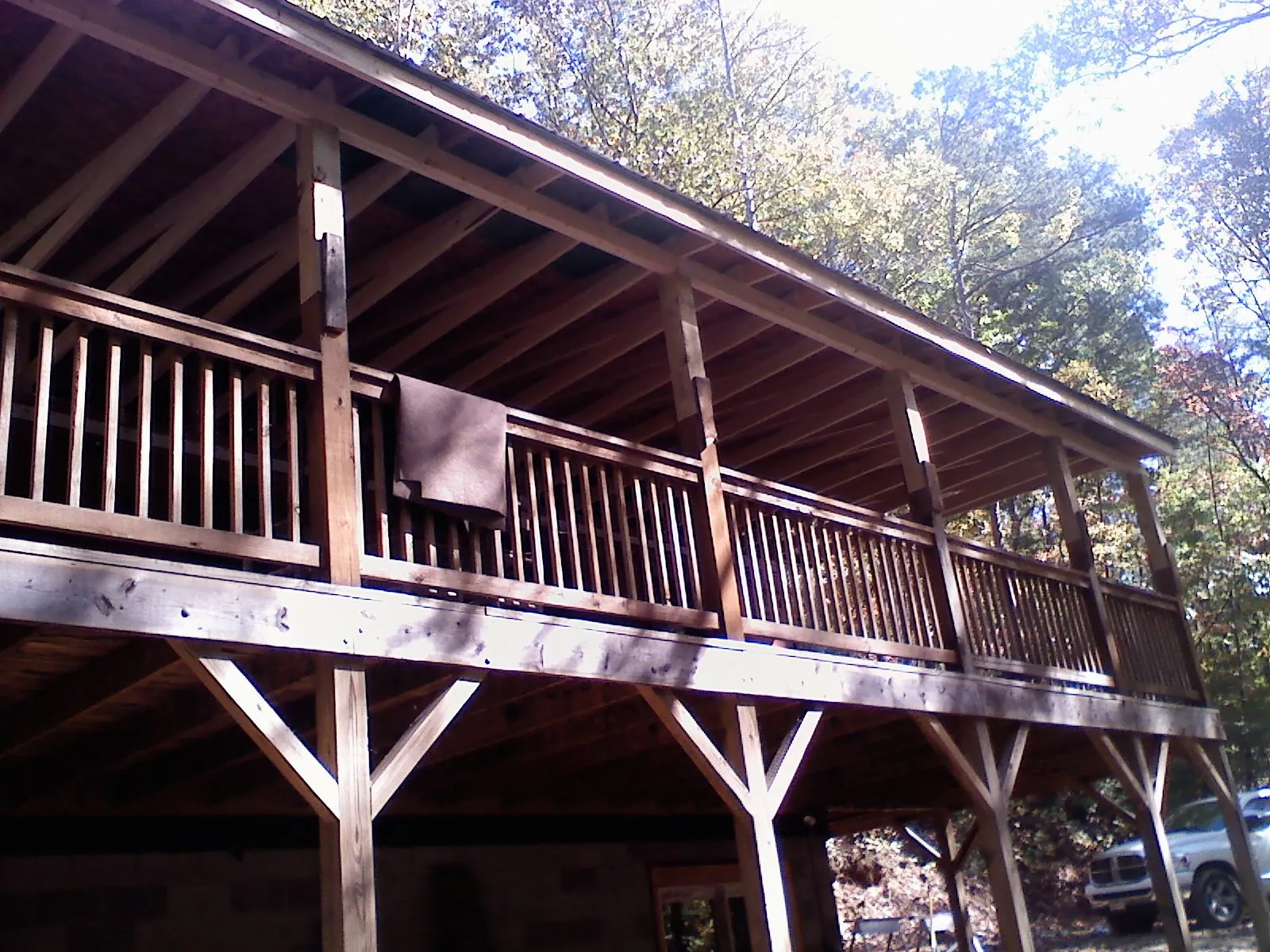 Timber framing under a new elevated porch and deck — Roof Leak Repair in De Graff by Roofing Brothers